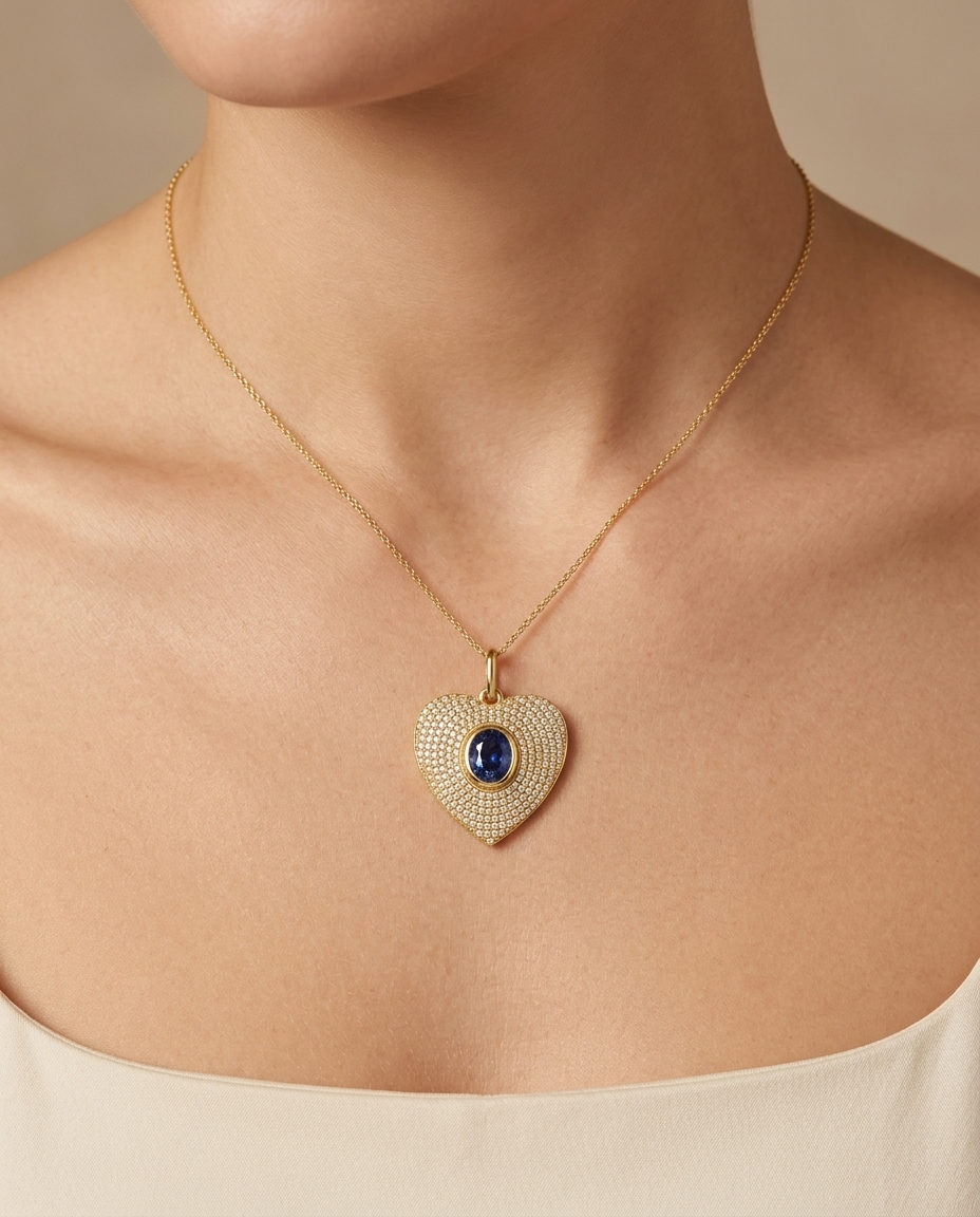 14KT Yellow Gold Blue Sapphire Heart Pendant on model