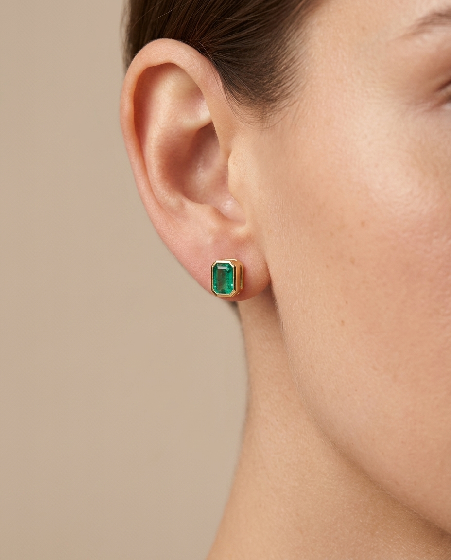 14KT Gold Emerald Earring Studs (5X7 MM) on model