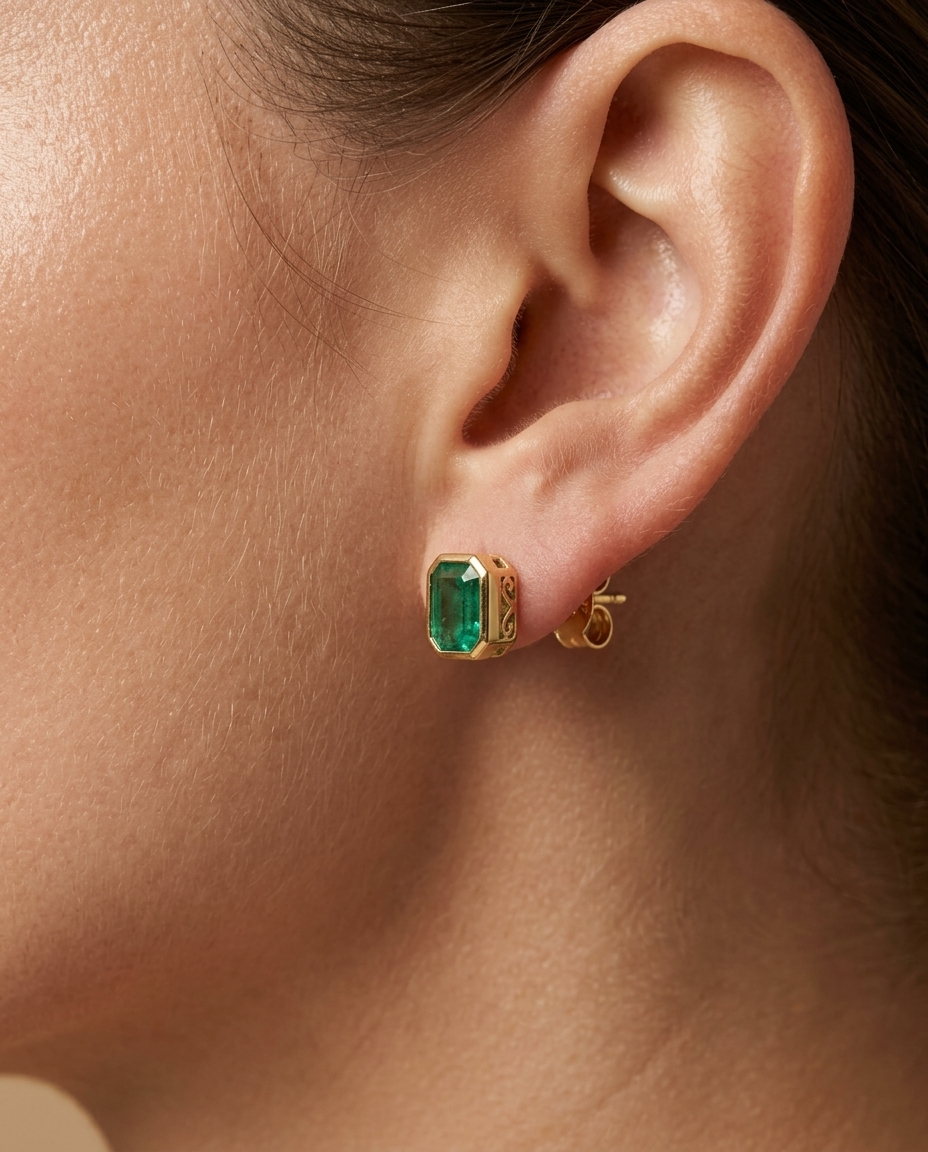 14KT Gold Emerald Earring Studs (5X7 MM) on model