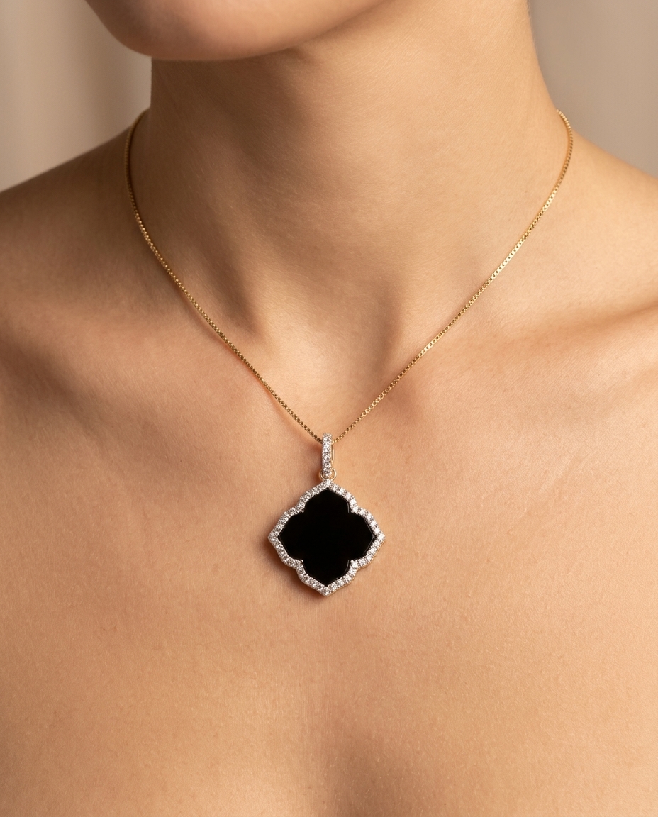 18KT Gold Black Onyx and Diamond Flower Pendant on model