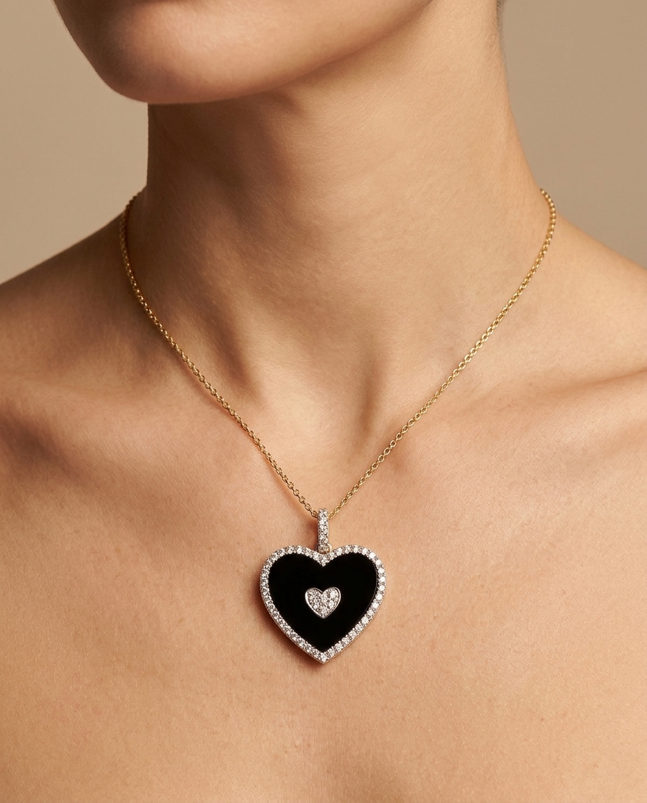 18KT Gold Black Onyx and Diamond Heart Pendant on model