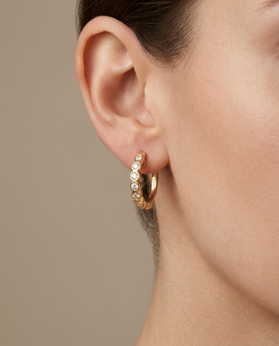 14KT Gold Diamond Huggies Earrings on model