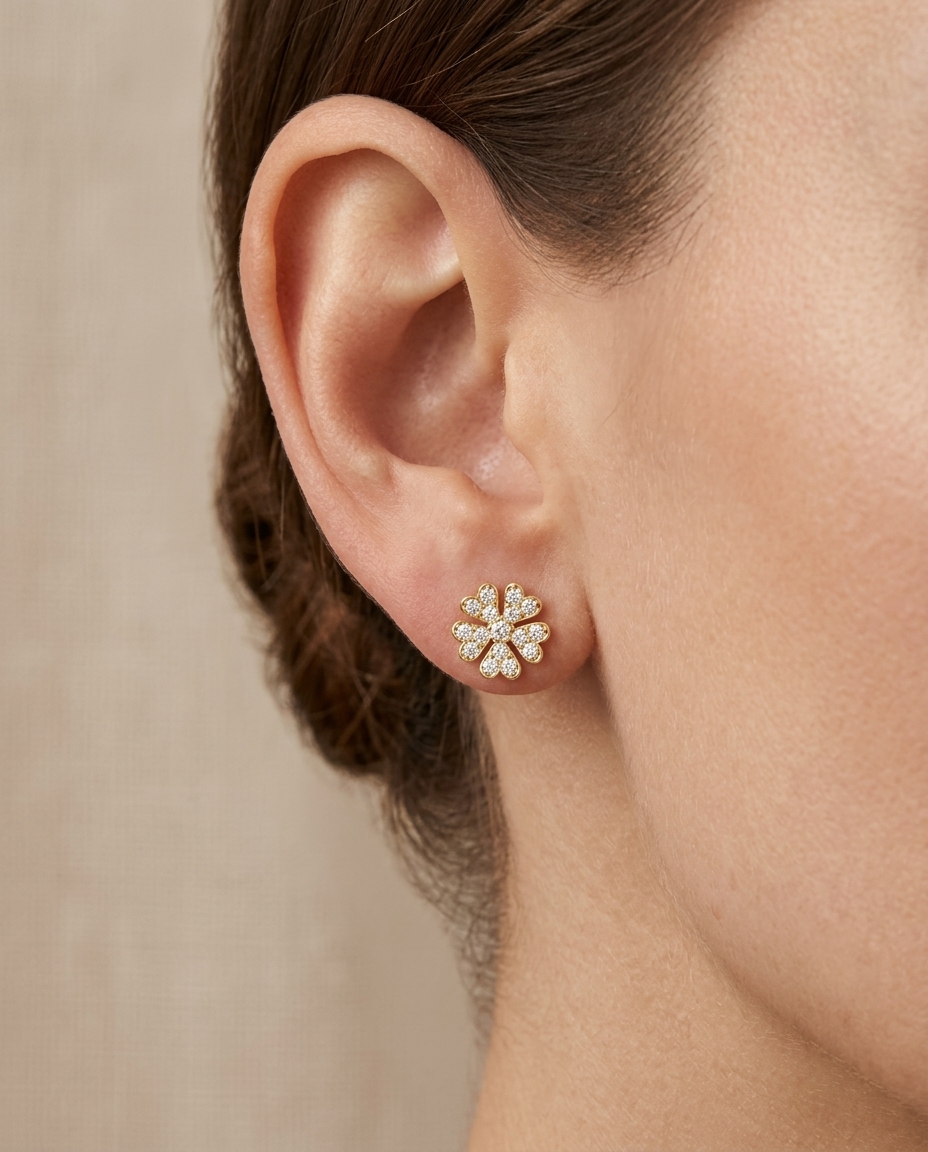 14KT Gold Star / Flower Diamond Earring on model
