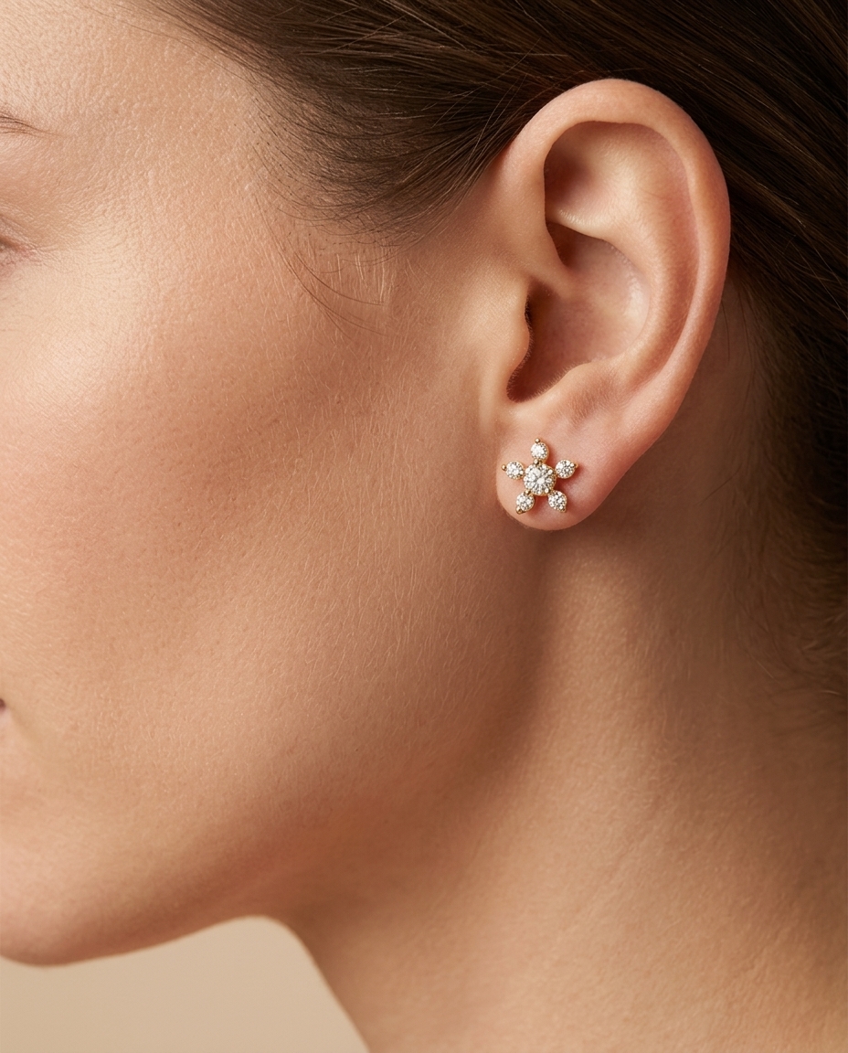 14KT Gold Star / Flower Diamond Earring on model
