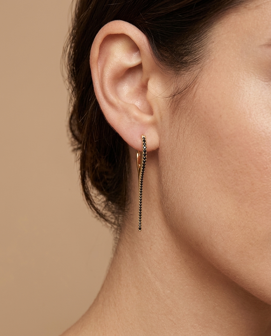 14KT Gold Black Diamond Spike Huggies on model