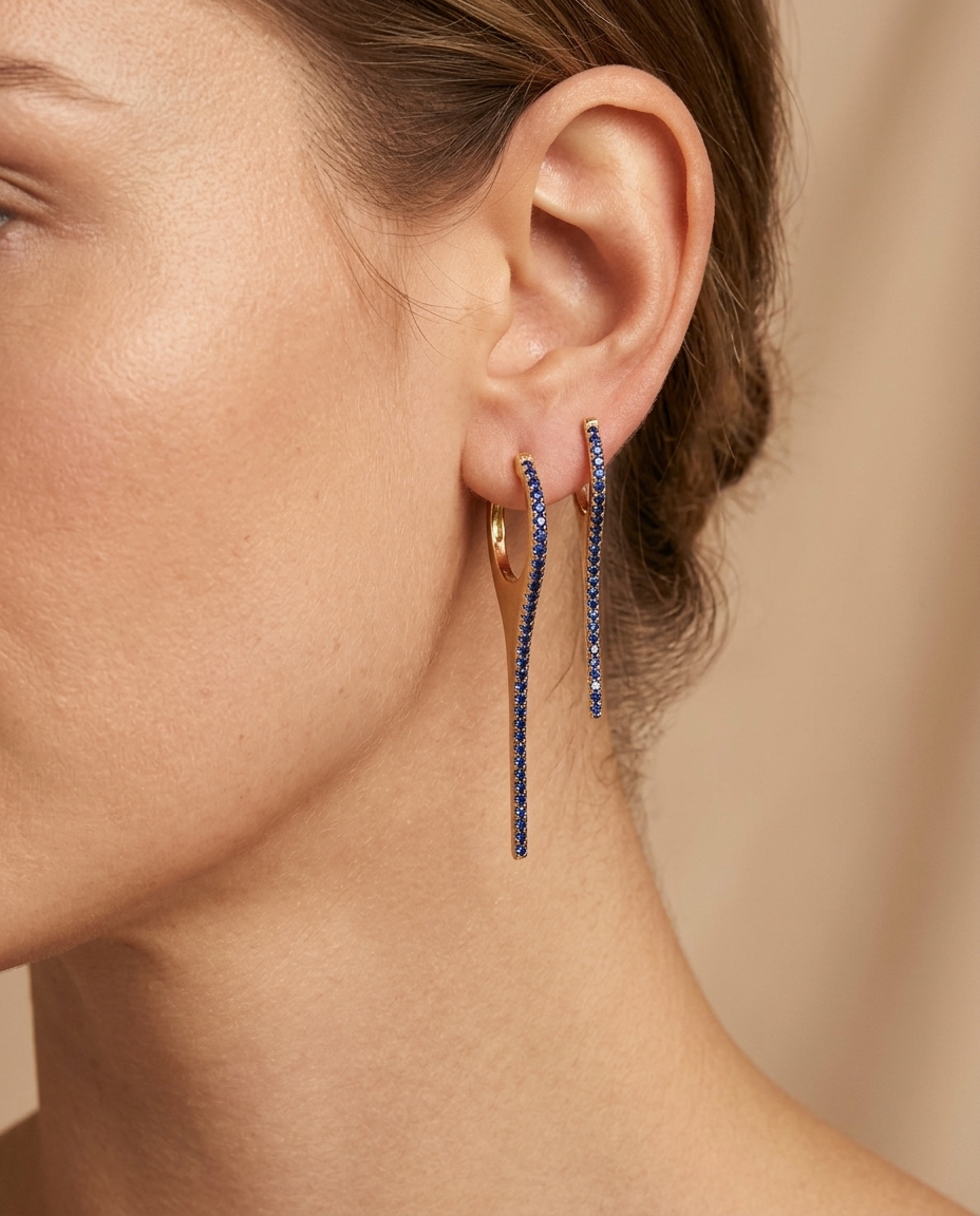 14KT Gold Blue Sapphire Spike Huggies on model
