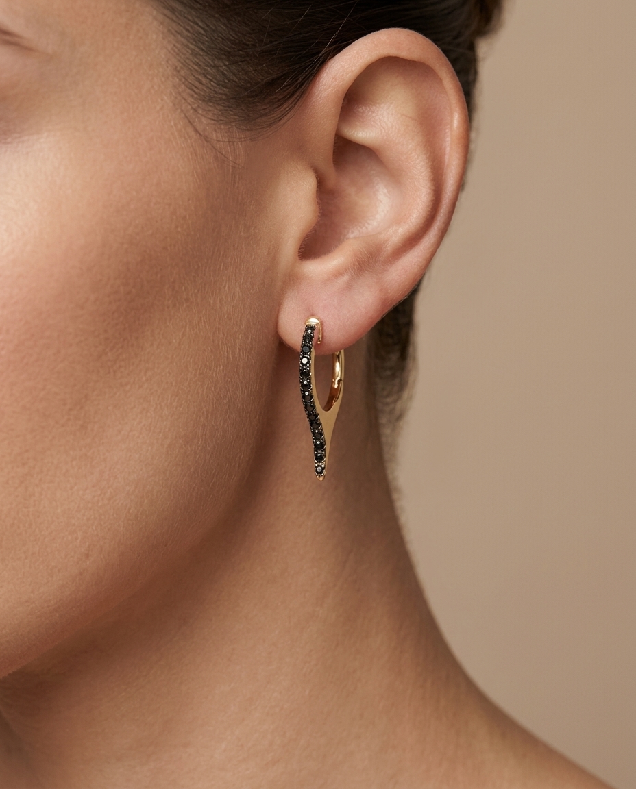 14KT Gold Black Diamond Spike Huggies on model