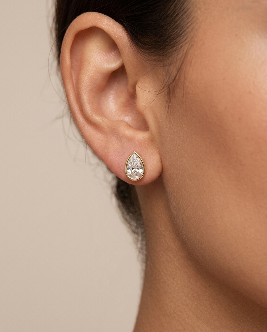 14KT Gold Tear Drop Diamond Bezel Set Earring on model
