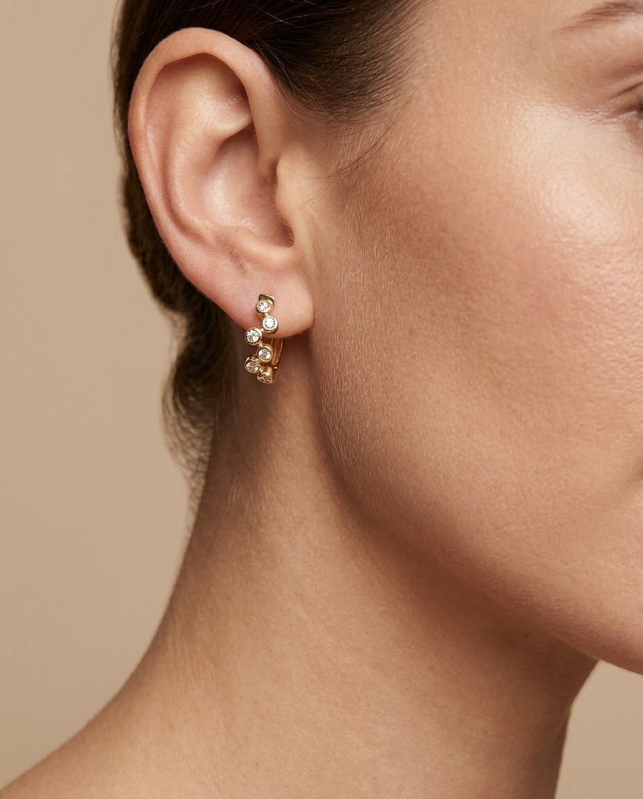14KT Yellow Gold Diamond Huggies Earring on model