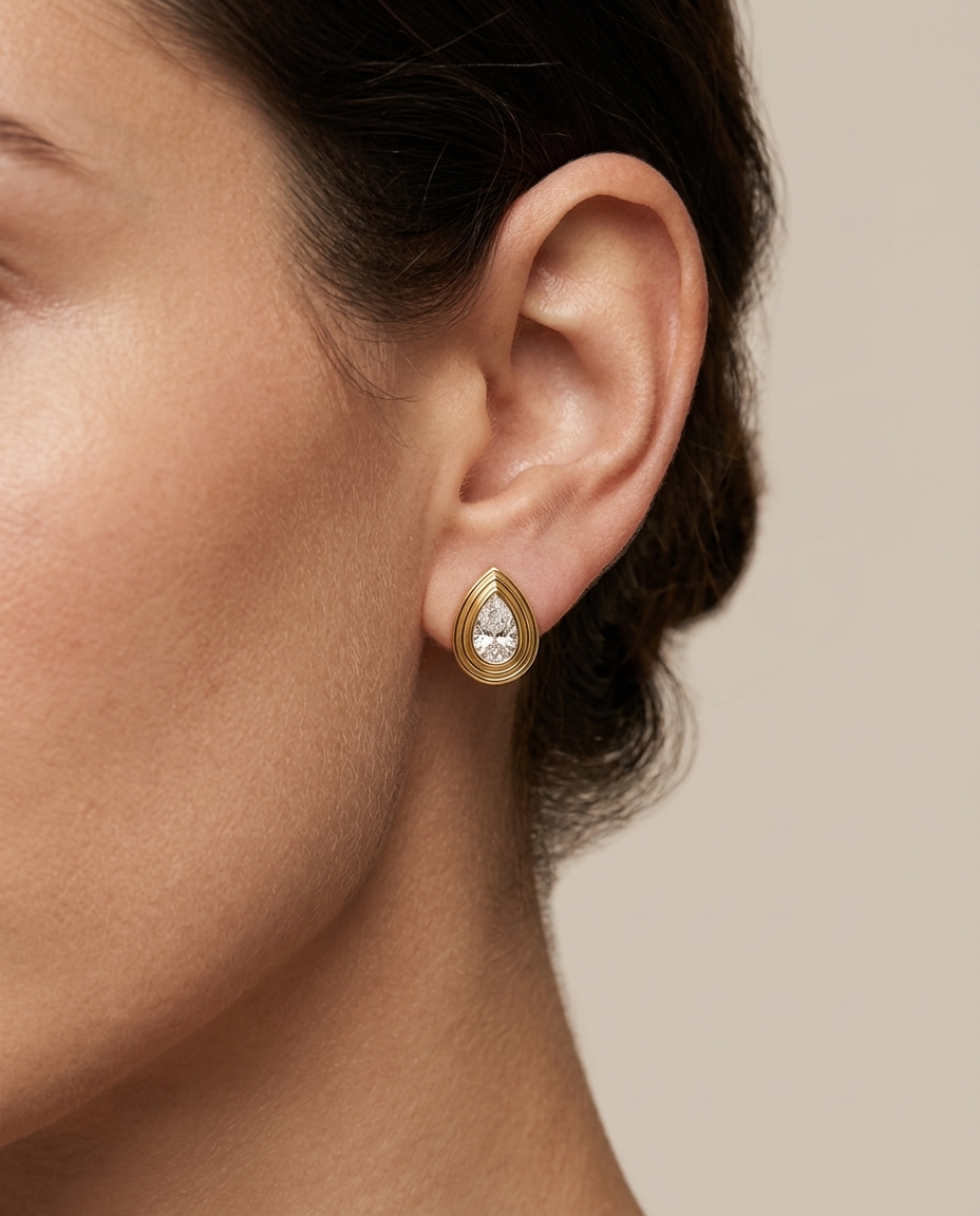 14KT Yellow Gold Pear Diamond Bezel Earring Studs on model