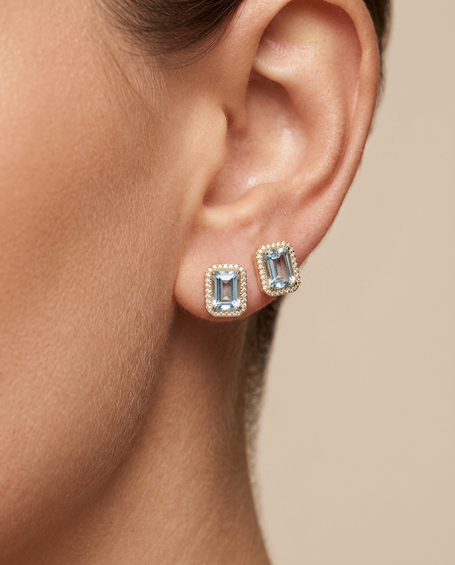 14KT Gold Emerald Cut Blue Topaz and Diamond Stud Earring on model