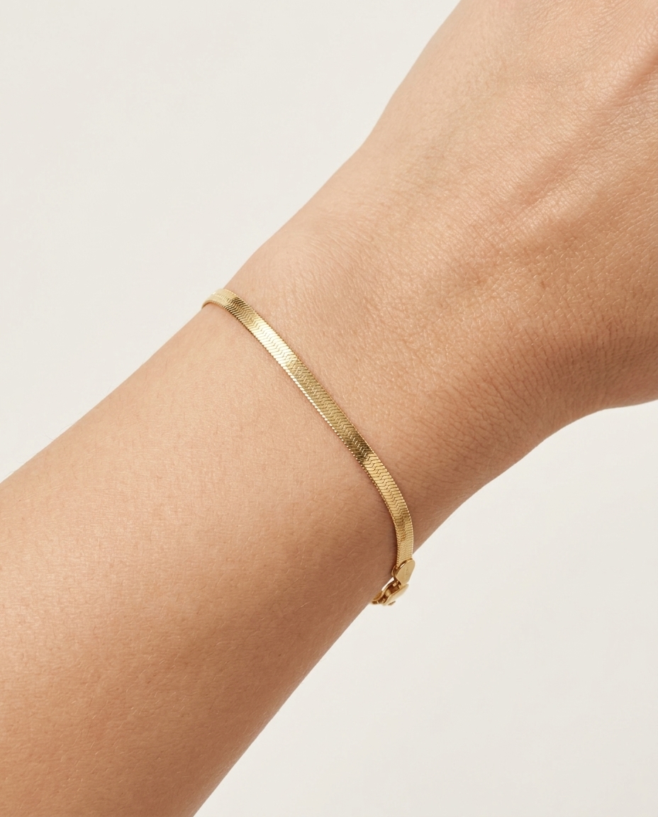 14KT Gold Herringbone Slim Chain Bracelet on model