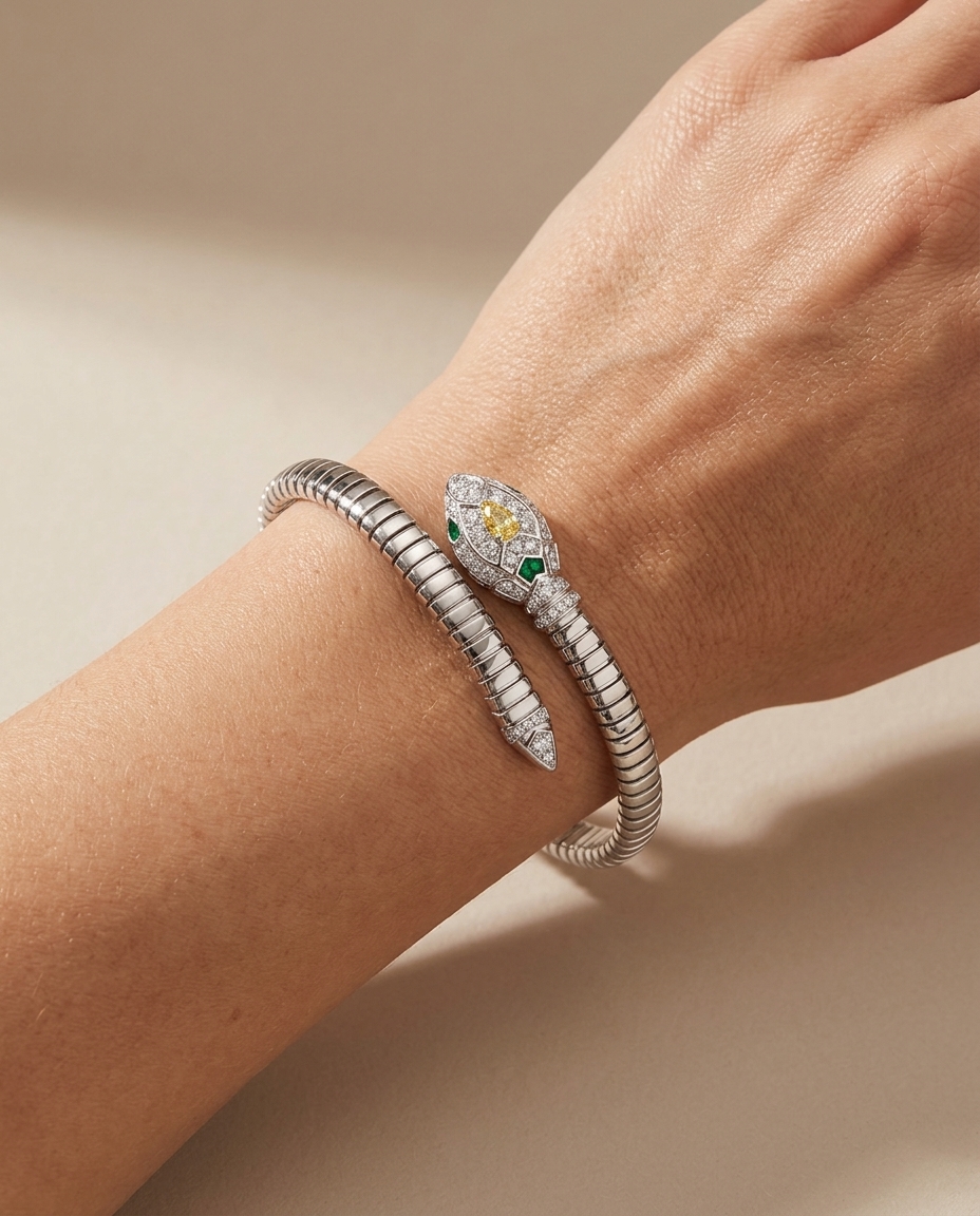 18KT White Gold Emerald and Diamonds and Yellow Diamond Snake Bangle on model