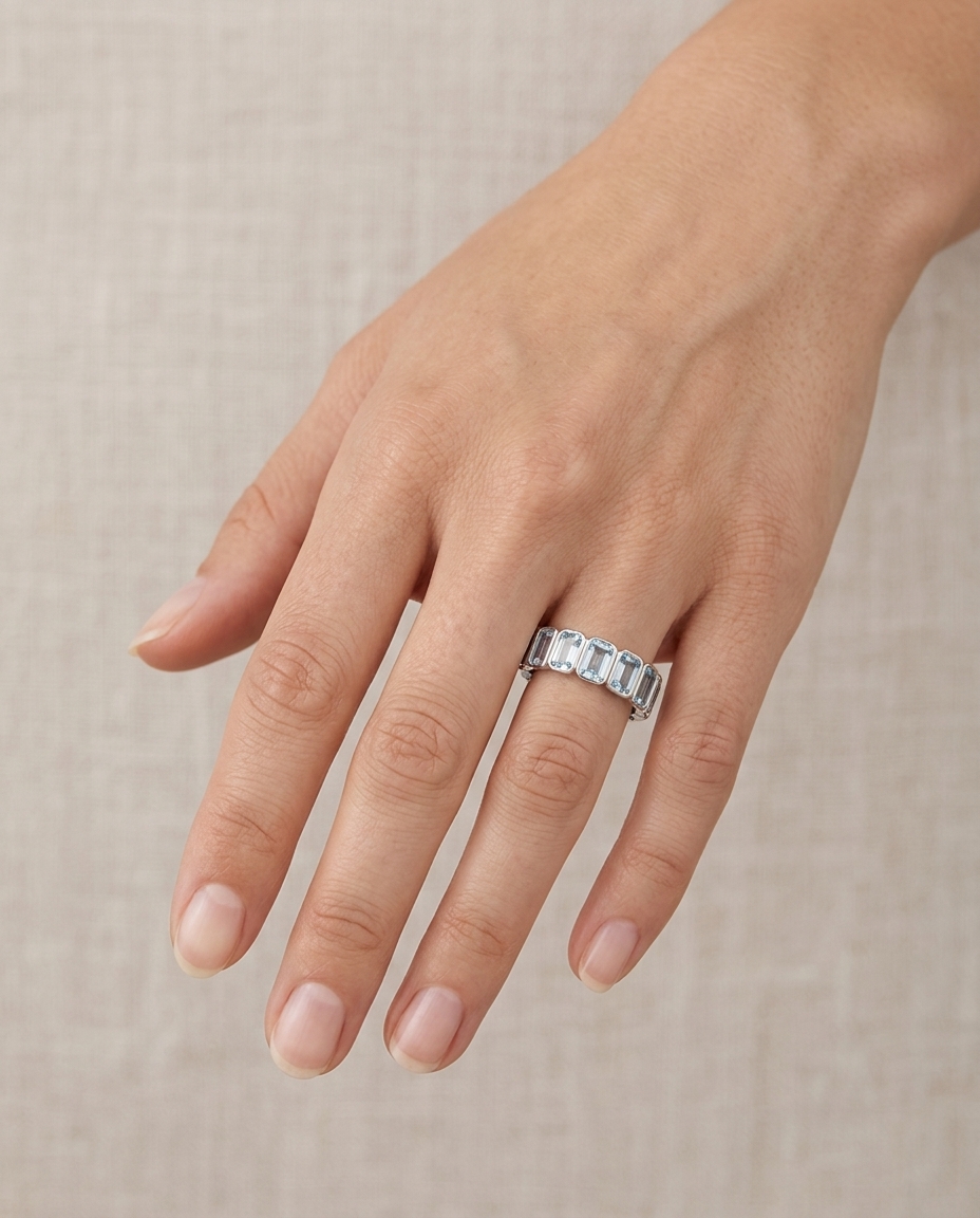 14KT White Gold Emerald Cut Aquamarine Eternity Ring on model