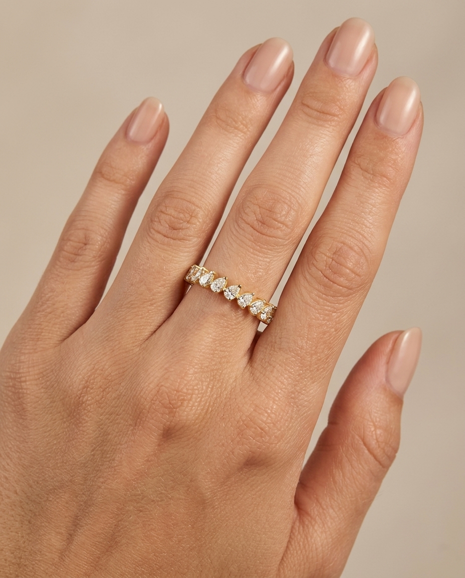 14KT Gold Ring with Pear Shape Diamonds on model