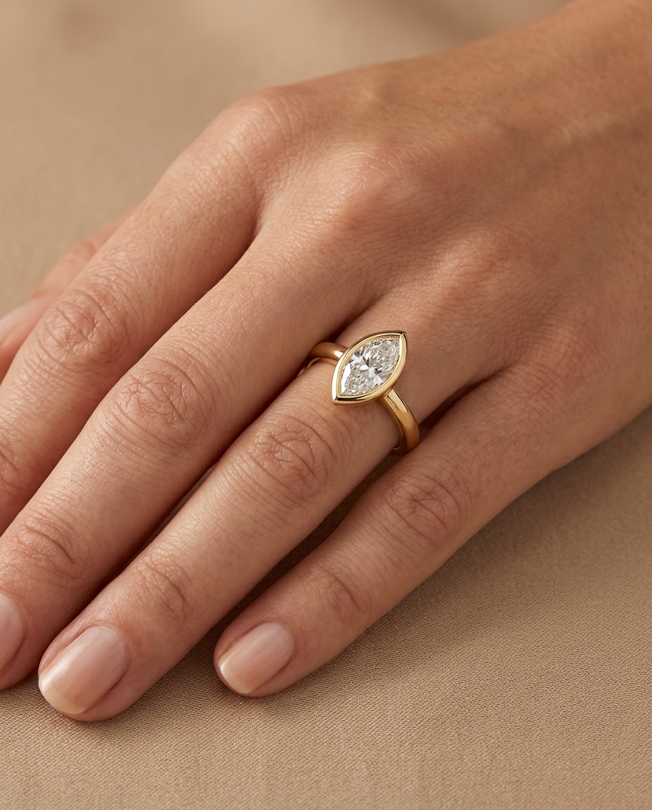 14KT Gold Ring with Single Bezeled Marquise Shape Diamond on model