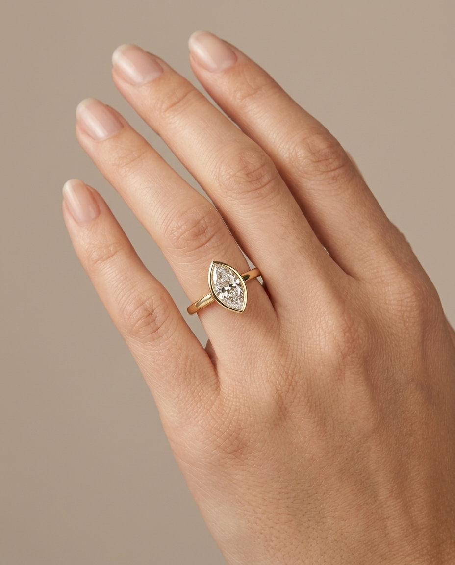 14KT Gold Ring with Single Bezeled Marquise Shape Diamond on model