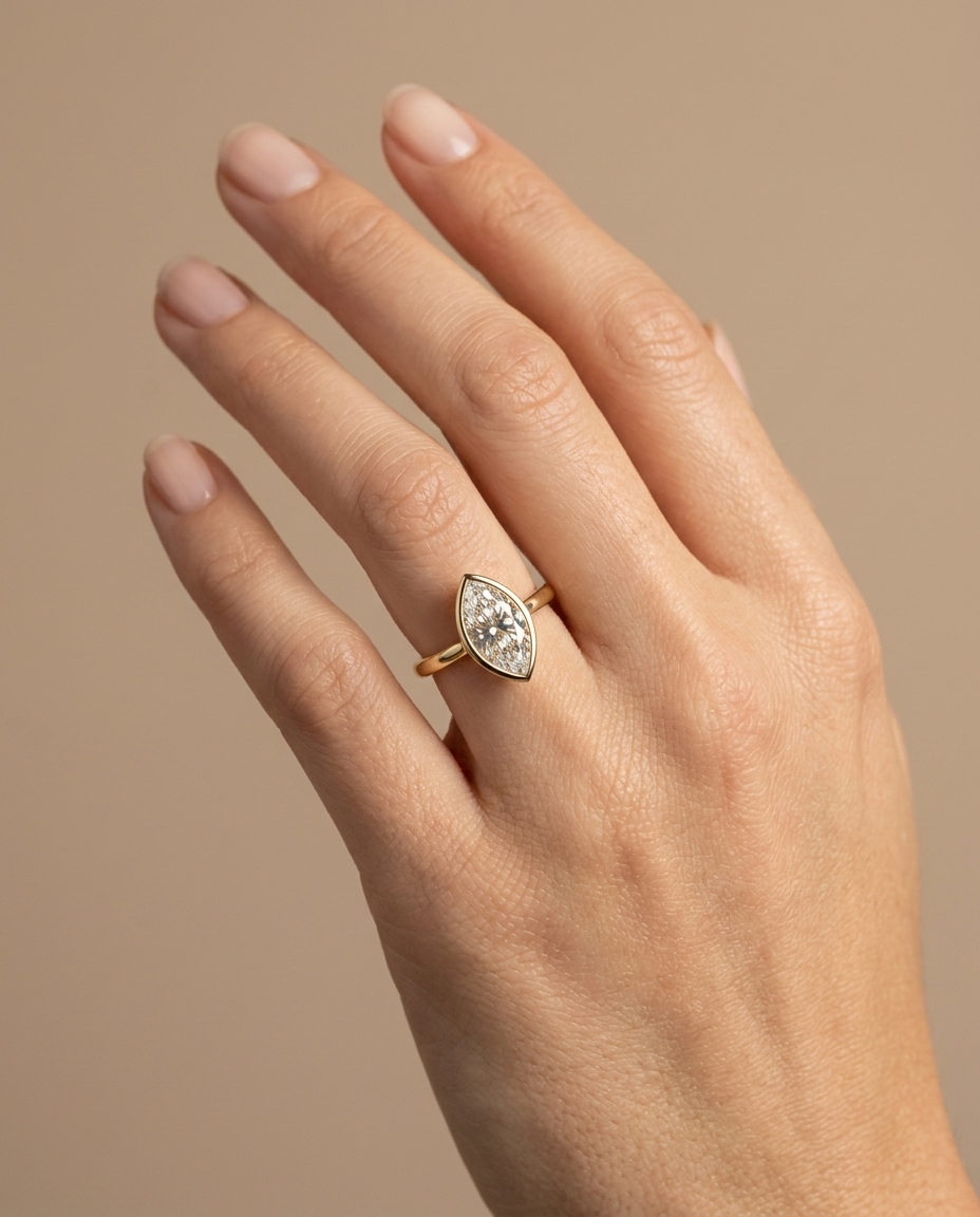 14KT Gold Ring with Single Bezeled Marquise Shape Diamond on model