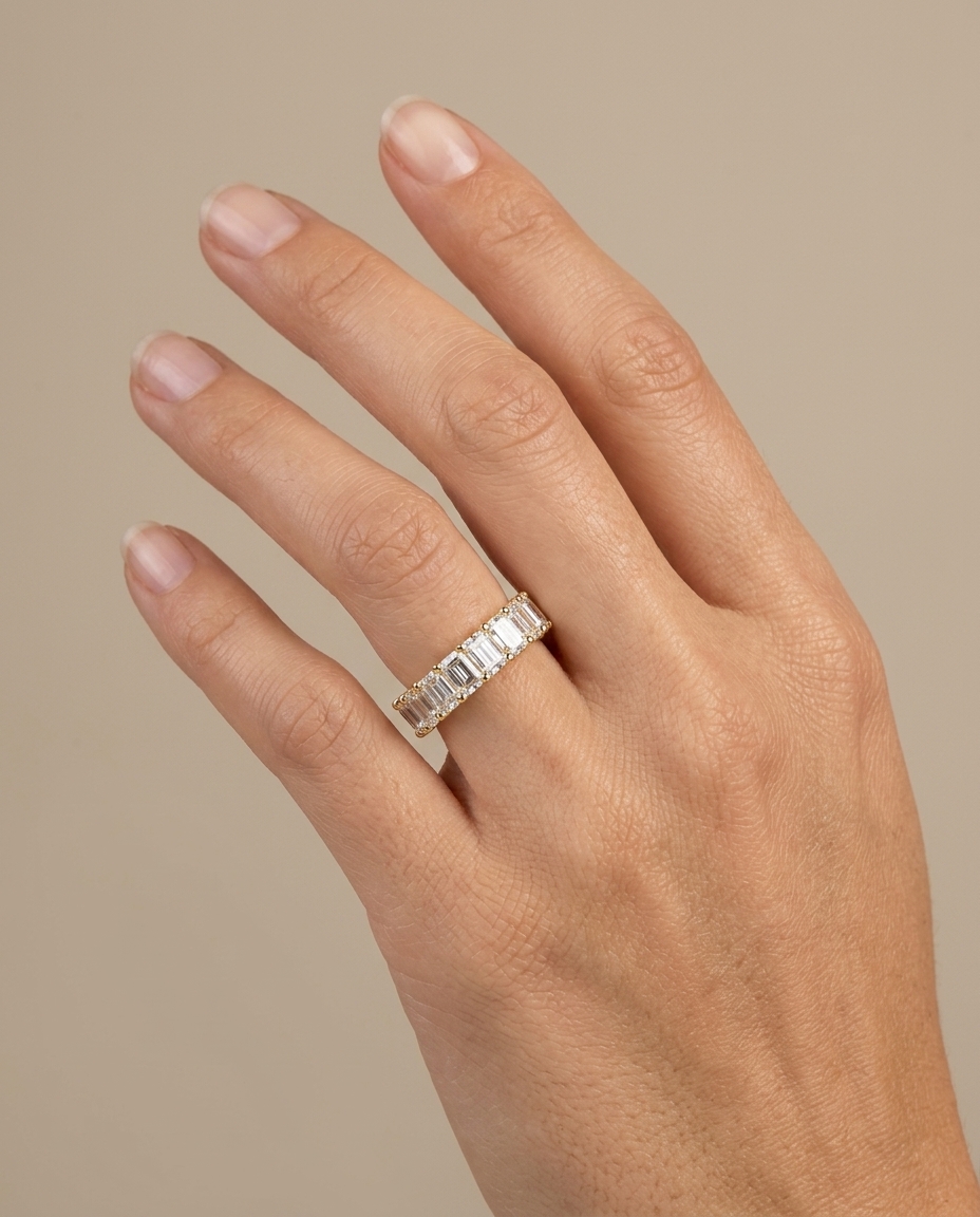 14KT Gold Round and Emerald Cut Diamond Ring on model