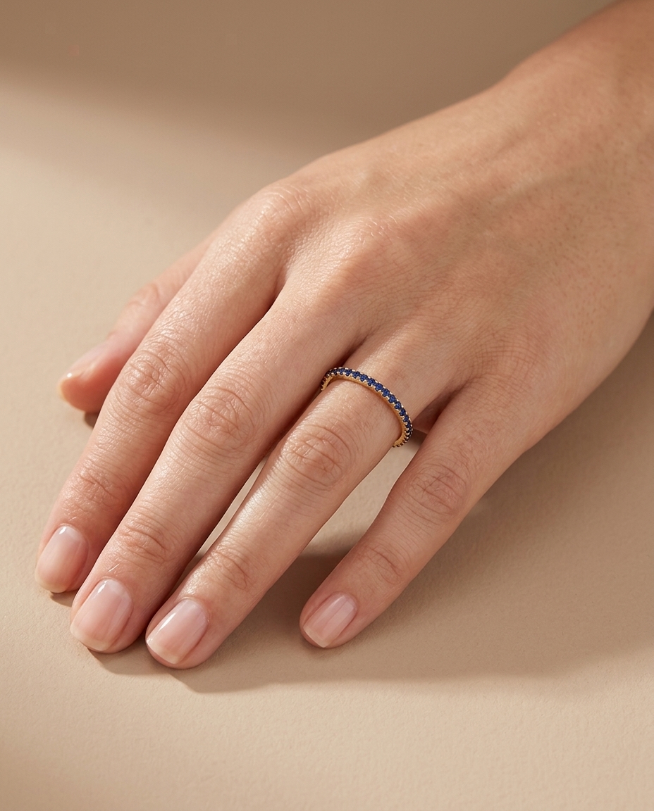 14KT Gold Blue Sapphire Ring Eternity Band on model