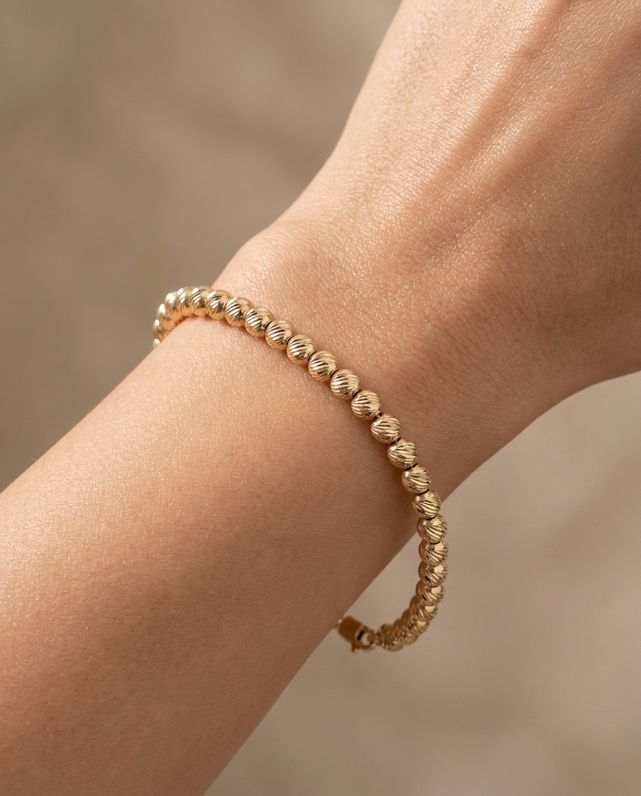 14KT Yellow Gold Ball Bracelet 7.5" on model