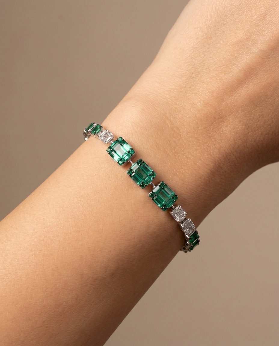 18KT White Gold Emerald and Diamonds Tennis Bracelet on model