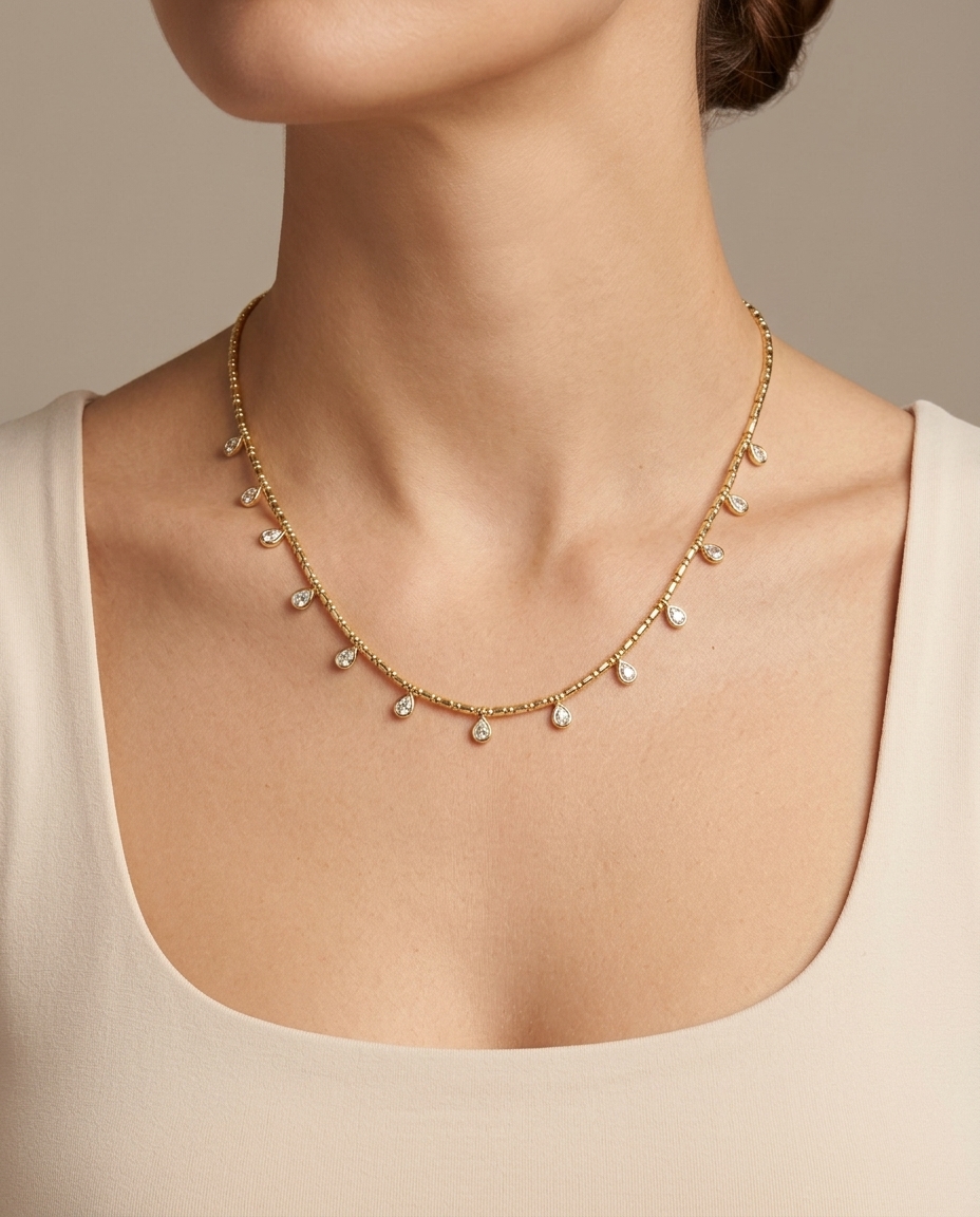14KT Gold Pear Shape Bezeled Diamond Dangling Necklace on model