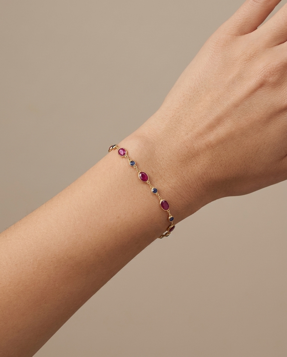 18KT Yellow Gold Ruby and Sapphire Station Bracelet on model