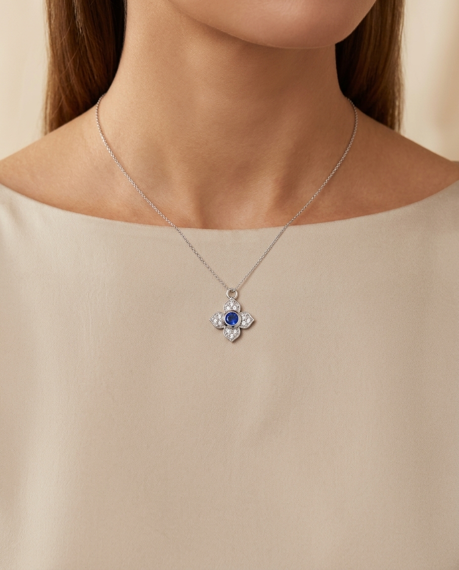 14KT Yellow Gold Blue Sapphire and Diamond Flower Pendant on model