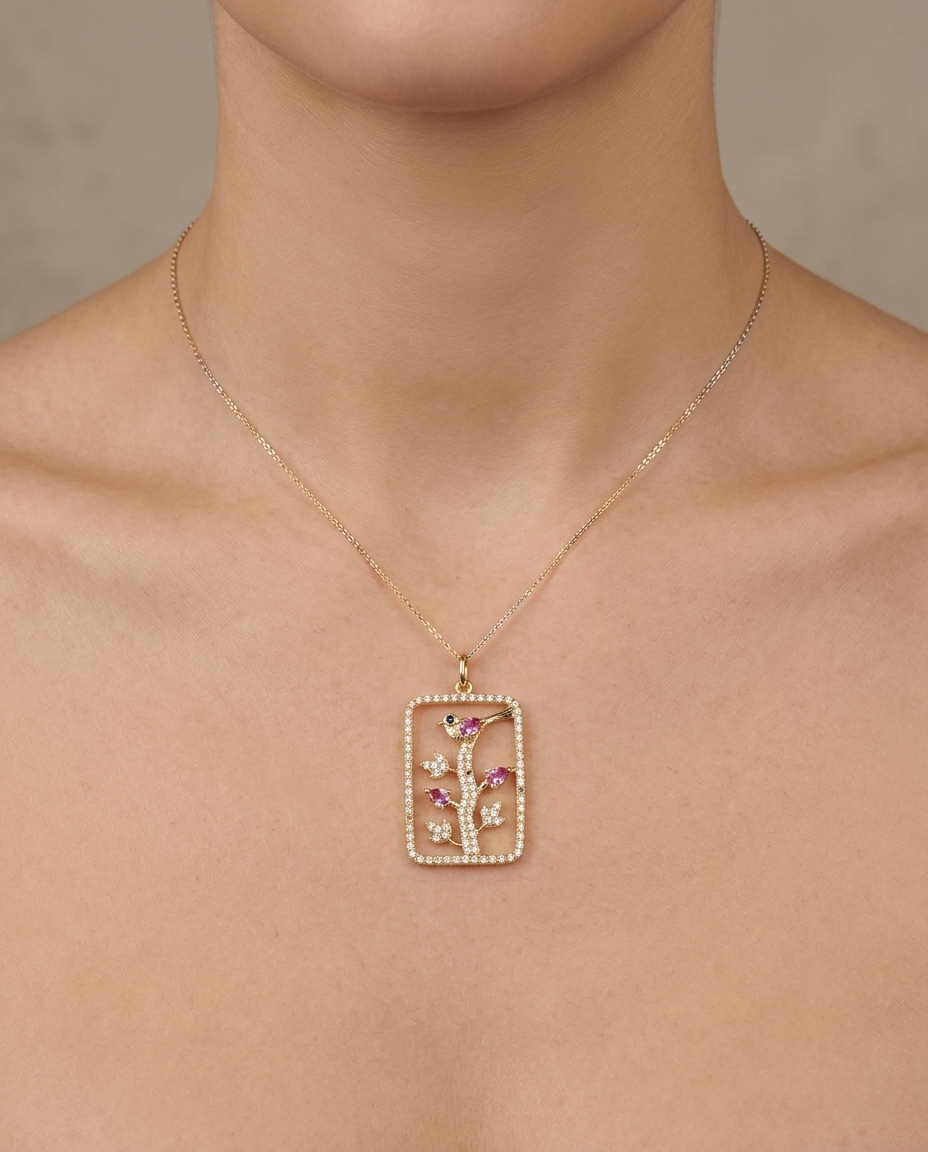 14KT Yellow Gold Clear Quartz Bird Pendant with Pink Sapphire and Diamonds on model