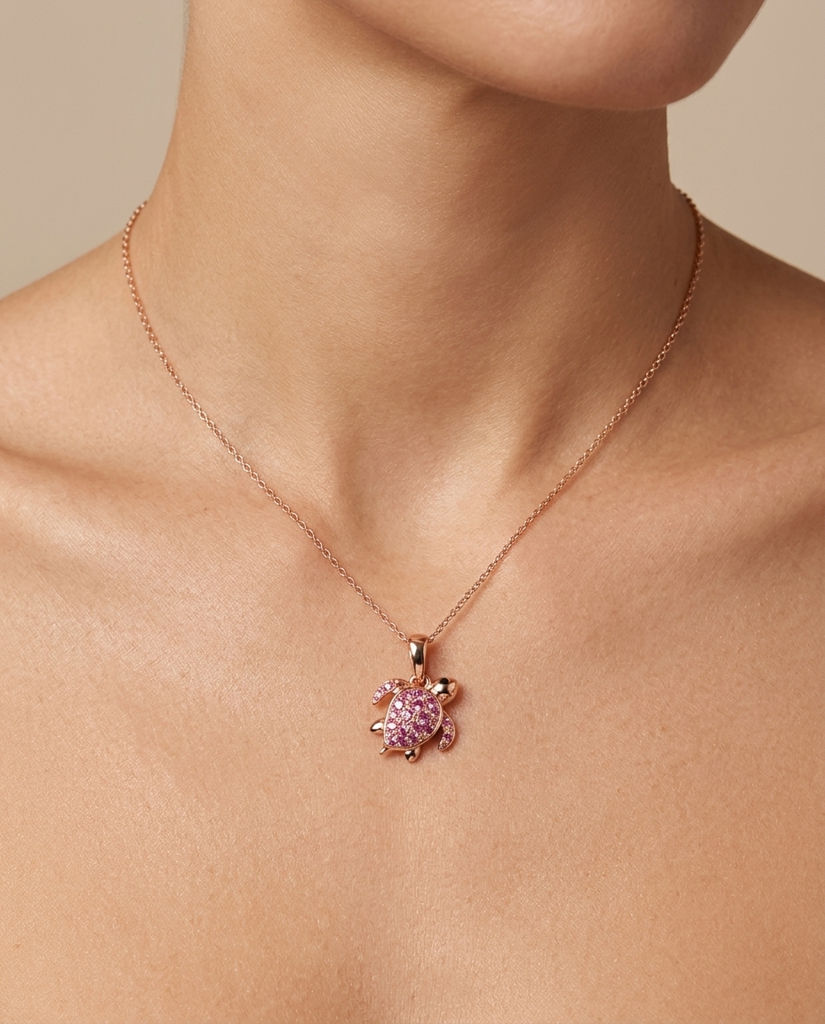 14KT Rose Gold Sea Turtle Pendant with Pink Sapphire on model