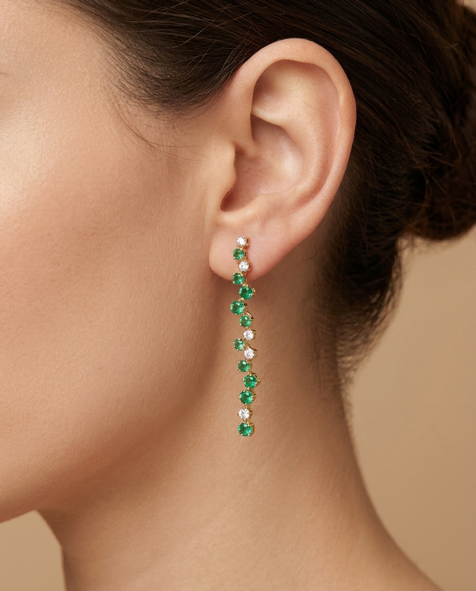 14KT Yellow Gold Diamond and Emerald Dangling Earrings on model
