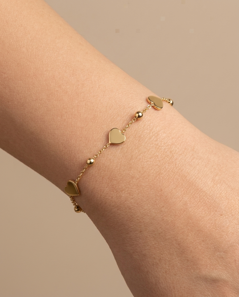 14KT Gold Heart Ball Braclet on model