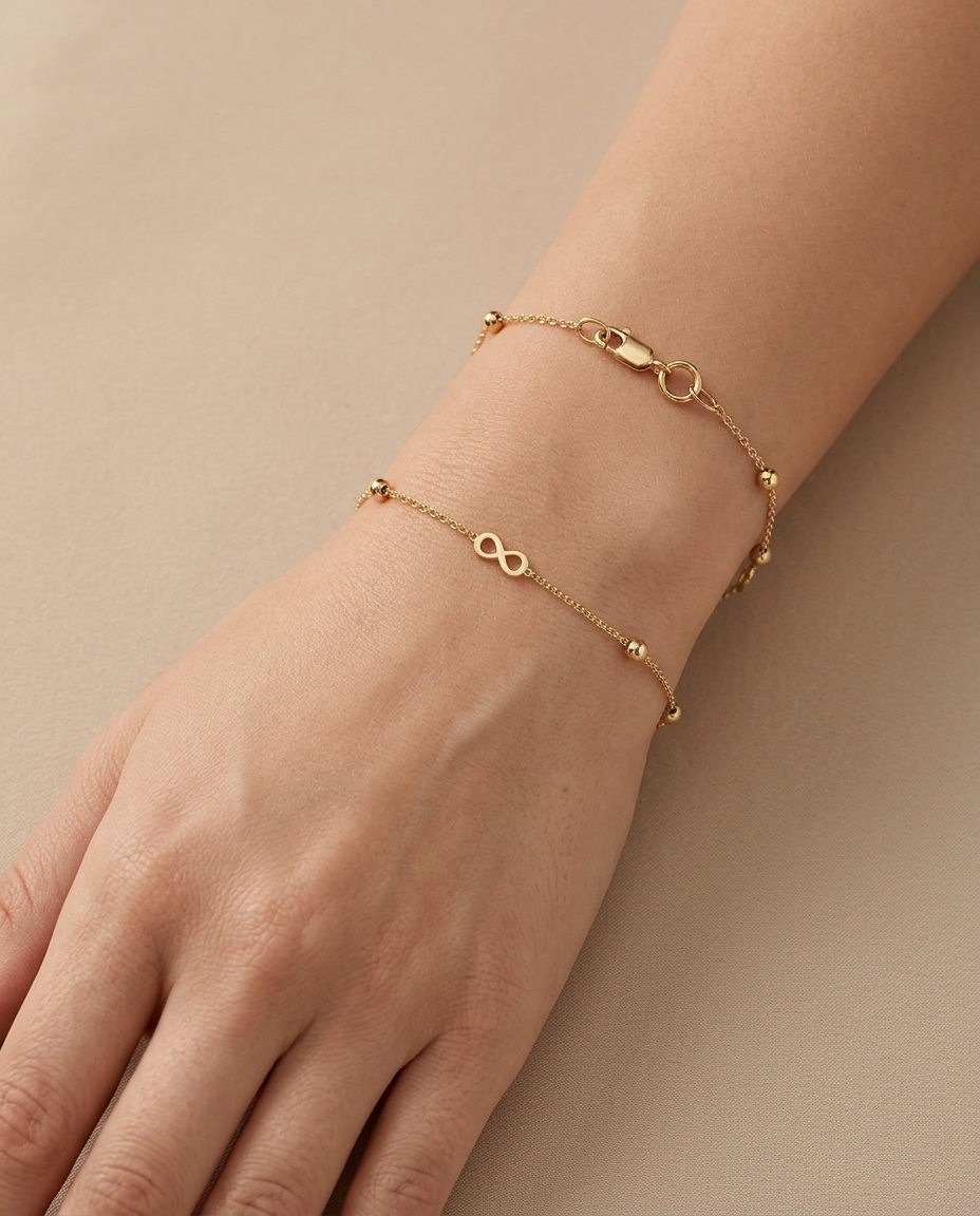 14KT Yellow Gold Infinity Braclet 7" on model