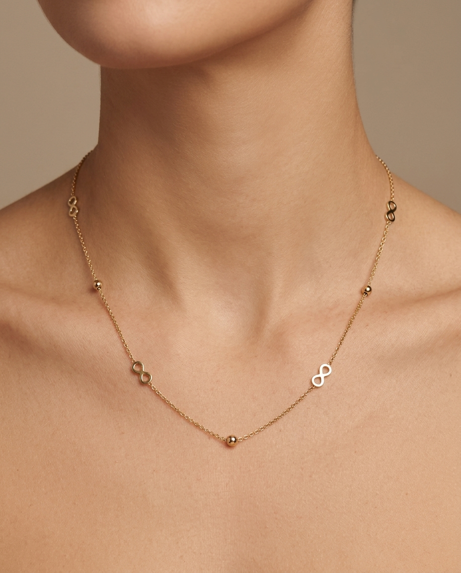 14KT Gold Infinity with Ball Necklace on model