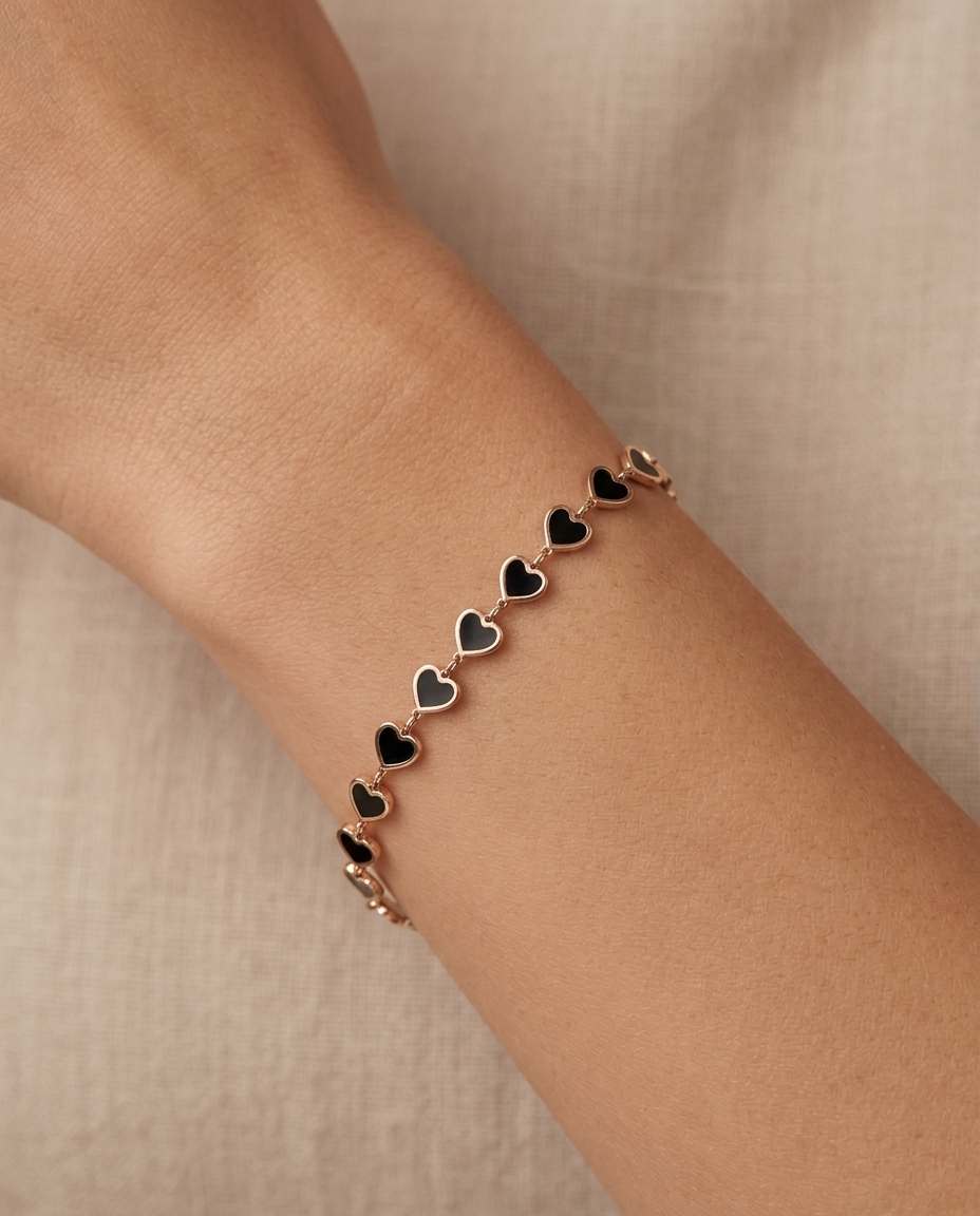 14KT Yellow Gold Black Onyx Heart Bracelet 7" on model