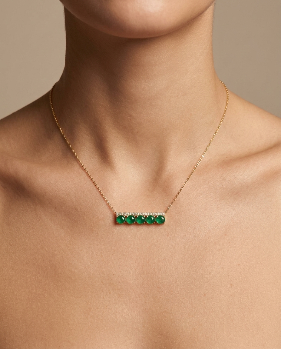 Diamond and Emeral Bar Necklace . in Yellow Gold on model