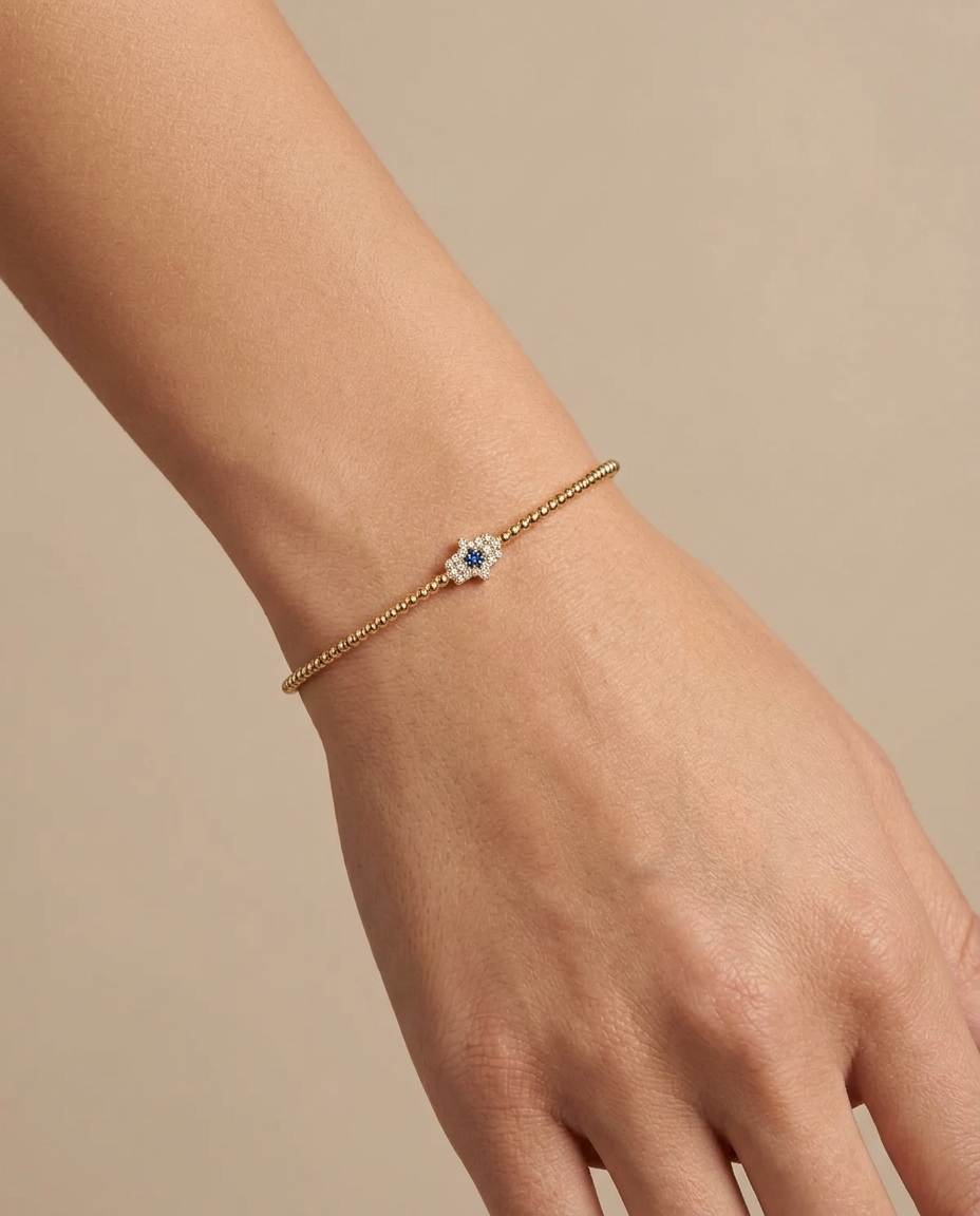 Beaded Shank Hamsa Diamond Bangle in Yellow Gold on model