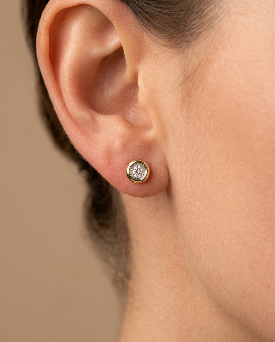 Single Stone Illusion Bezel Earrings in Yellow Gold on model