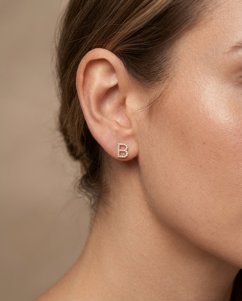B Initial Diamond Earrings in Yellow Gold on model