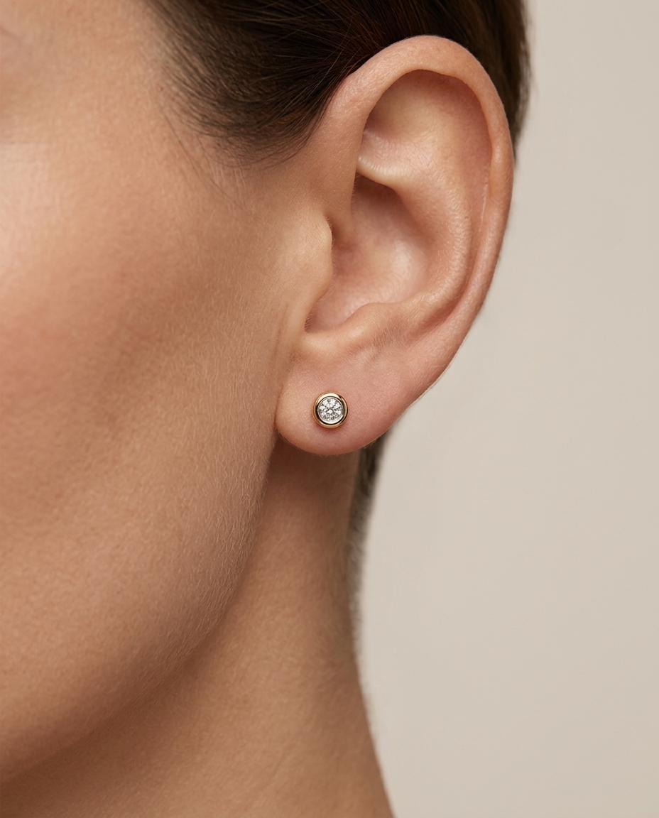 Single Stone Illusion Bezel Earrings in Yellow Gold on model