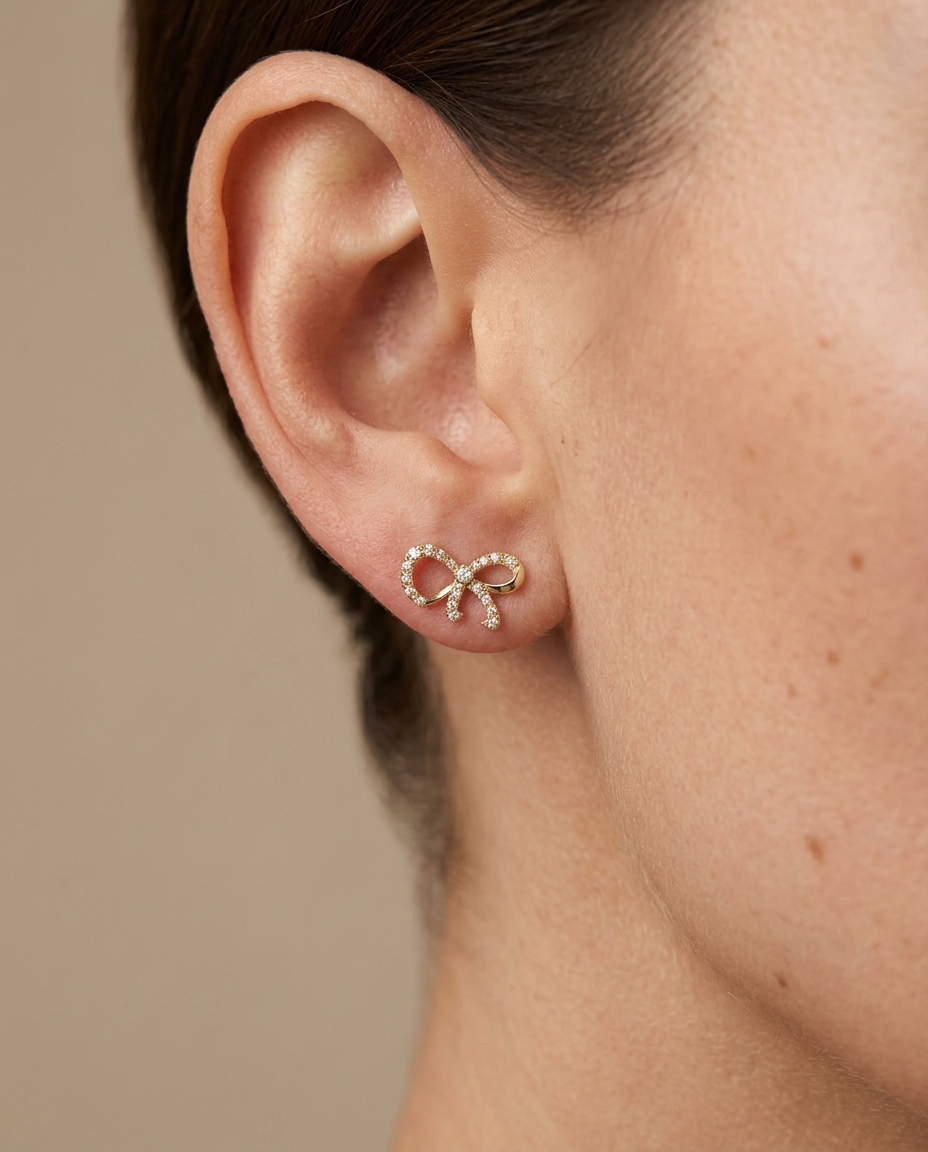 Bow Ribbon Diamond Earrings in Yellow Gold on model
