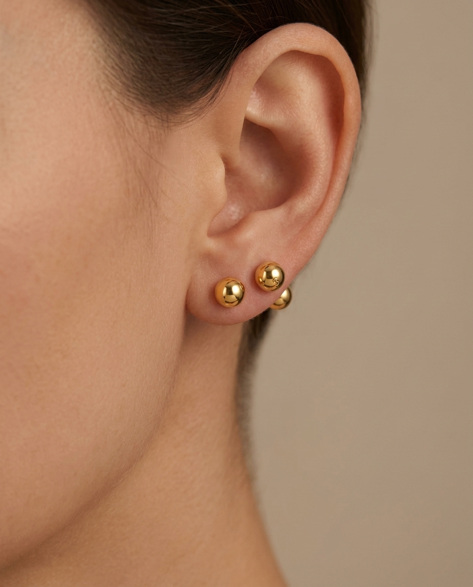 Ball Earring in Yellow Gold on model