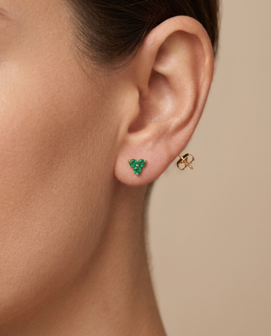 3 Stone Tringle Emerald Earrings in Yellow Gold on model