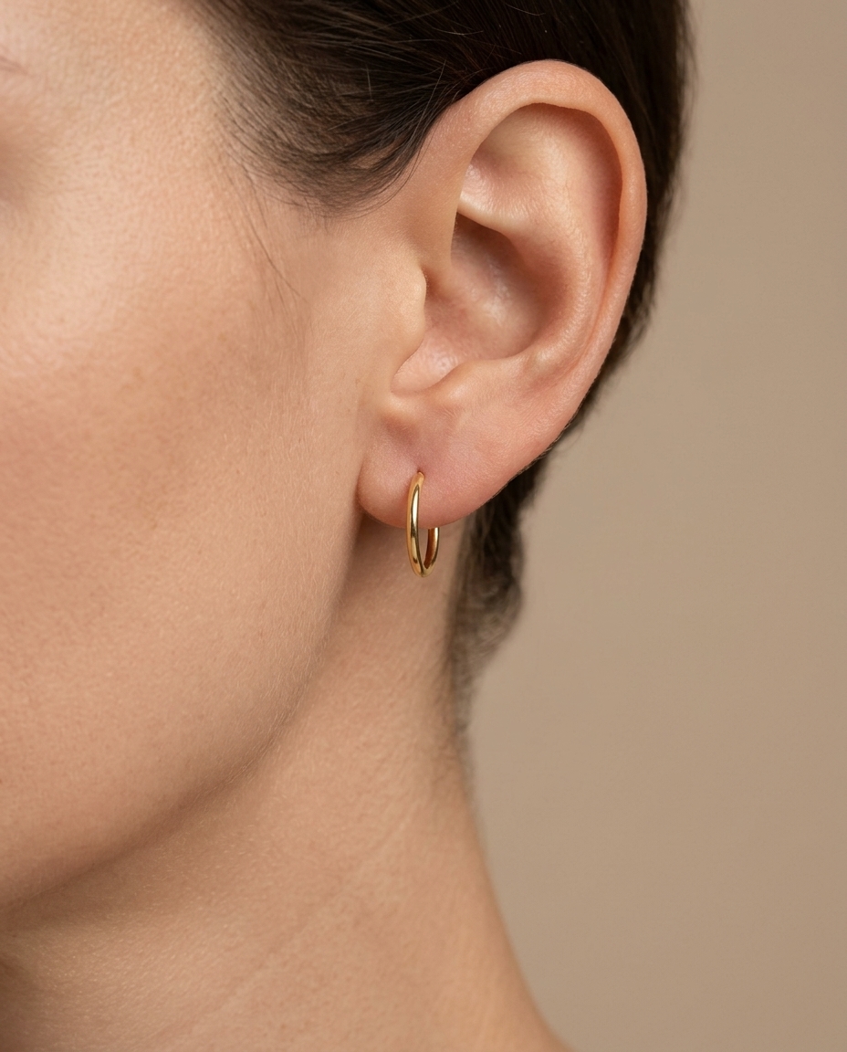 Plain Thin Huggies Earring in Yellow Gold on model