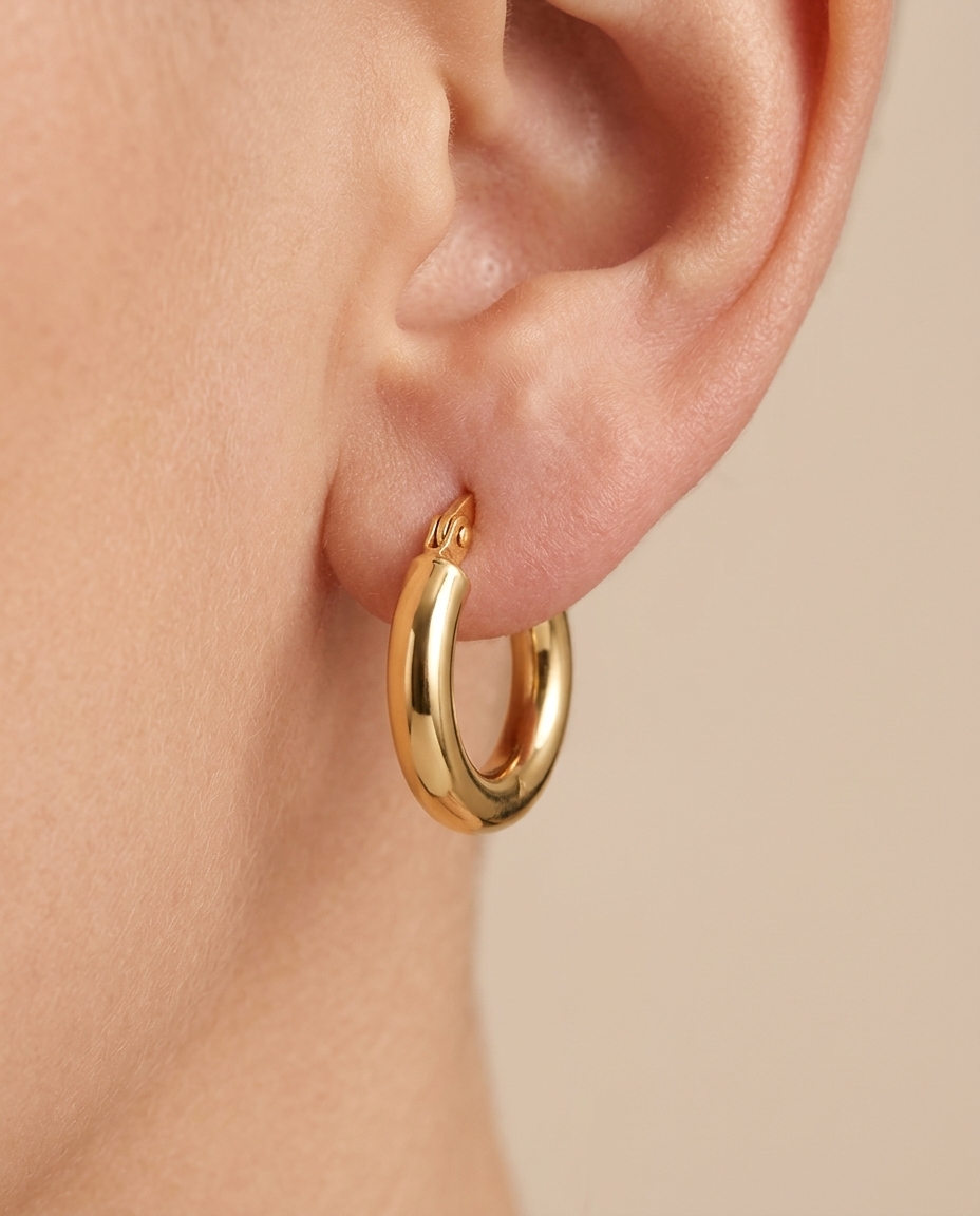 Plain Huggies Earring in Yellow Gold on model