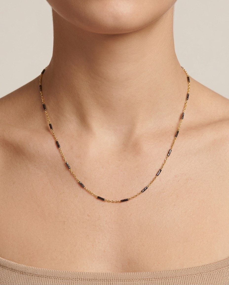 Hollow Carrel Station 2 Tone Chain in Yellow Gold on model