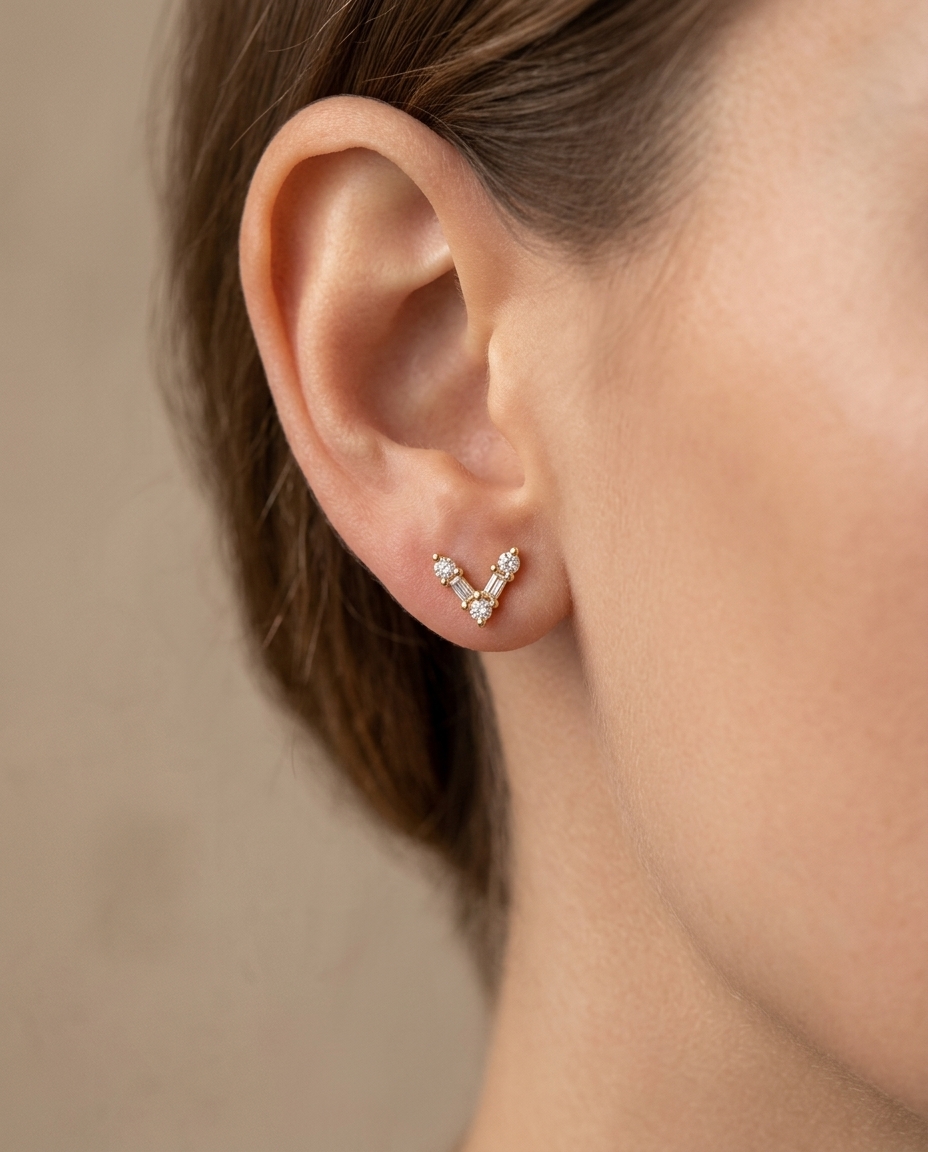 Diamond V Shape Studs . in Yellow Gold on model