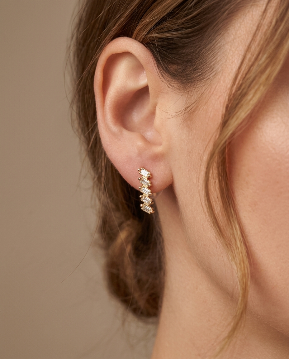 Baguette Diamond Earring . in Yellow Gold on model