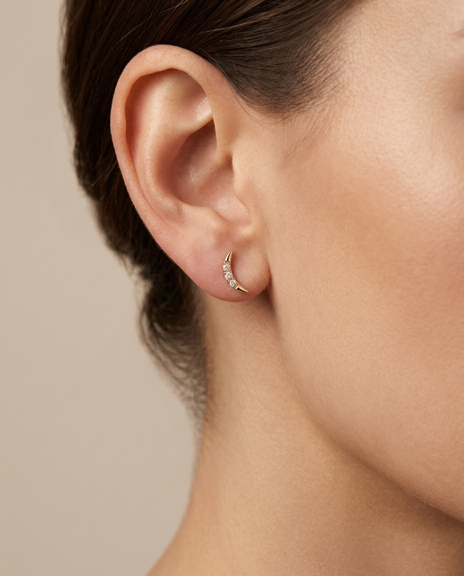 Gold Earrings with Diamonds . in Yellow Gold on model